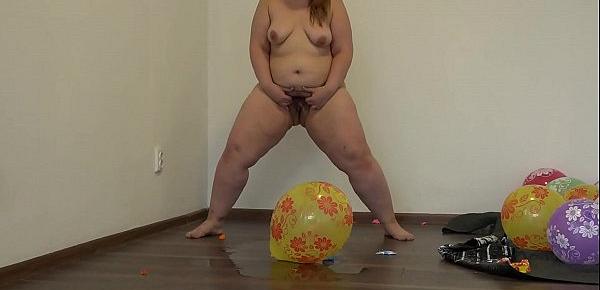  A fat girl in pantyhose sits down on balloons and pisses
